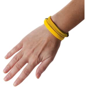 A yellow Mitjansi bracelet displayed on a hand, showcasing its braided design and simple style.