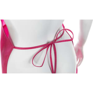 A pink apron with a tied bow at the back, featuring a sleek design and soft fabric. It includes a branding logo.