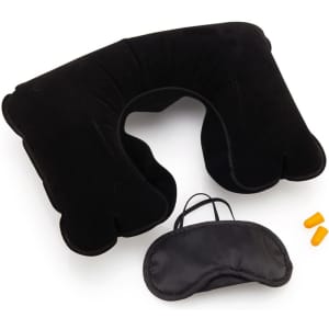 A black neck pillow with a sleep mask and orange earplugs, arranged neatly together.