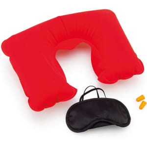 A red inflatable neck pillow, black eye mask, and orange earplugs are displayed together on a white background.