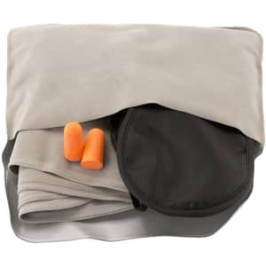 A grey travel blanket with a black carrying case and two orange earplugs on top. The set is compact and portable.