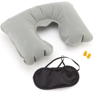 A grey inflatable travel pillow, earplugs, and a black sleep mask, complete with a logo.