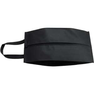 A black shoe bag with a zippered compartment and two carrying handles. It features a logo.