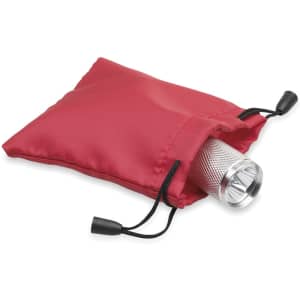 A red drawstring bag containing a silver flashlight, with the drawstring pulled tight.