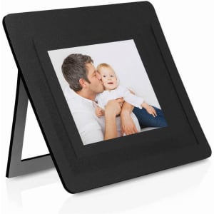 A black photo frame with a stand, displaying a picture of a man and a child.
