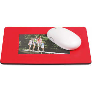 A red mousepad featuring a photo frame and a white computer mouse on top of it.