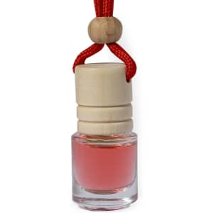 A pink air freshener in a clear glass bottle, topped with a wooden cap and hung by a red cord.