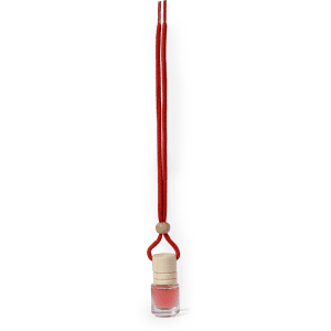 A pink air freshener in a glass bottle, suspended from a red cord with a wooden bead.