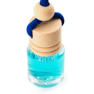 A small glass vial containing blue liquid, topped with a wooden cap and a blue cord for hanging.
