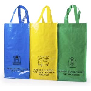 Three reusable bags in blue, yellow, and green, each with handles and distinct icons for recycling materials.