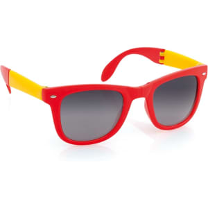 A pair of red sunglasses with yellow accents and dark lenses, featuring a logo on the side.