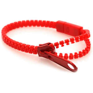 A red bracelet featuring a zip design and a clasp. It has a simple logo on the clasp.