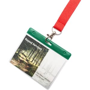 A name badge with a green top, clear holder, and red lanyard featuring a nature background image.