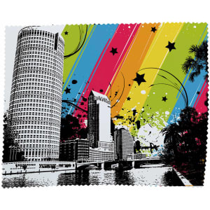 A vibrant cleaning cloth featuring a city skyline with multicoloured abstract patterns and a black and white design.
