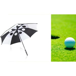 A black and white golf umbrella with circular patterns, featuring a handle and a logo.