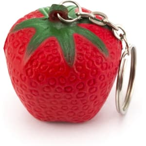 A red strawberry-shaped keyring with a green stem and a metal keychain attachment.