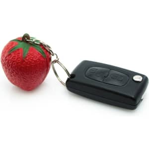 A red strawberry-shaped keyring attached to a black remote key. It features a keychain loop.