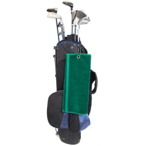 A green golf towel hangs from a black golf bag with clubs visible. The bag features a blue section and has a logo.