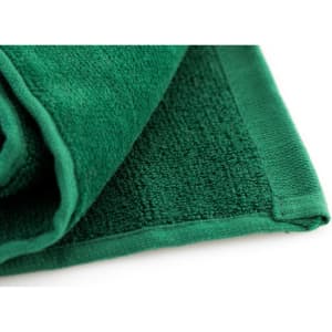 A green golf towel with a textured surface and a neat hemmed edge. It features a small logo.