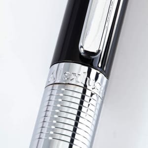 A black and silver stylus touch ball pen featuring a chrome grip and a logo.