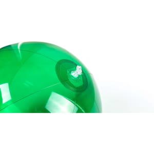 A green beach ball with a valve for inflation, featuring a glossy finish.