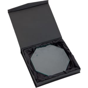An octagonal glass plaque in a black presentation box with black satin lining. The plaque has a hanging hole.