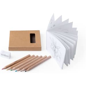A set of coloured pencils in shades of pink, green, blue, and yellow, alongside a sketchbook and a sharpener in a cardboard box.