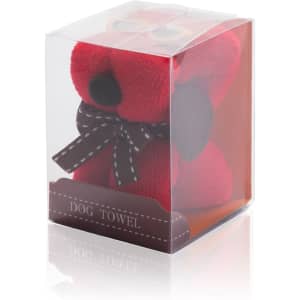 A red towel shaped like a teddy bear, packaged in a clear box with a ribbon and a label reading "Dog Towel."