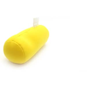 A yellow decorative pillow with a rounded shape and a tag on one side.