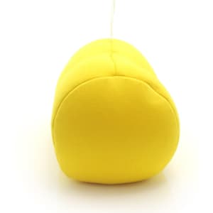 A yellow pillow with a rounded shape, featuring a hanging loop. It has a simple, smooth design and no visible branding.