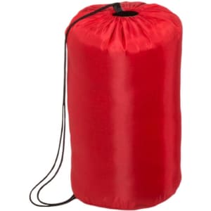 A red sleeping bag stored in a cylindrical shape, featuring a drawstring closure and a smooth surface.