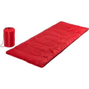 A red sleeping bag laid out flat next to a matching red storage bag. The sleeping bag features a quilted design.