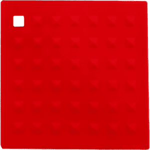 A red silicone place mat featuring a textured surface with pyramid shapes and a square corner. It has a logo.