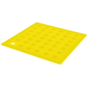 A yellow silicone place mat with a textured surface and a small square cutout in one corner.