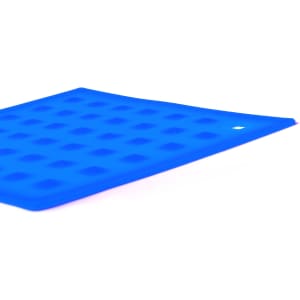 A blue silicone place mat with a textured surface and rounded shapes, featuring a small hole in one corner.