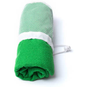 A green absorbent towel with a mesh outer layer, featuring a drawstring closure. It has a logo.