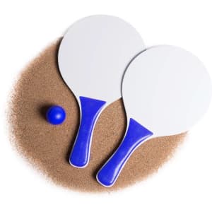 Two beach rackets with blue handles and a blue ball, sitting on a sandy surface.