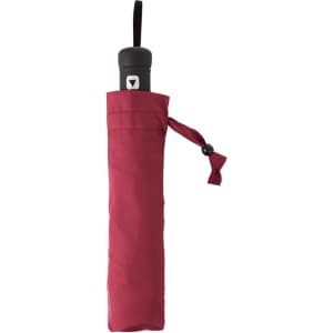 A red umbrella stored in a matching sleeve, featuring a black handle with a logo.