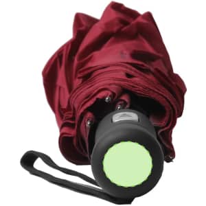 A red umbrella with a black handle and a circular green button at the base. The umbrella is closed and compact.