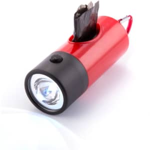 A red and black waste bag dispenser shaped like a flashlight, with a roll of bags partially visible inside.