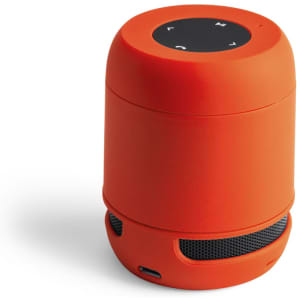 An orange Braiss Speaker with a circular top and a mesh speaker grill at the bottom.