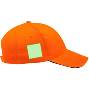 An orange cap with a blank area for branding or logos, featuring a curved brim and a ventilation eyelet.