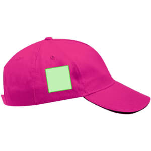 A bright pink cap with a flat brim and a blank green patch on the side. It has a logo on the front.