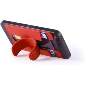 A red multipurpose pouch attached to a smartphone, holding a credit card and featuring a built-in stand.