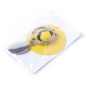A silver keyring with a round coin attached, packaged with a yellow backing.