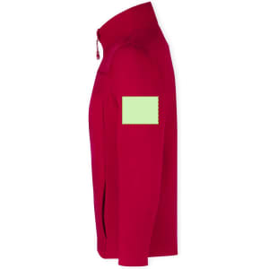 A red soft shell jacket featuring a logo on the sleeve and a green label patch.