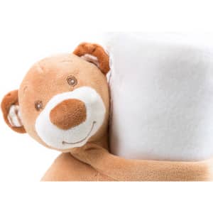 A soft, tan blanket featuring a cuddly bear design, with white fleece material. It has a logo on the blanket.