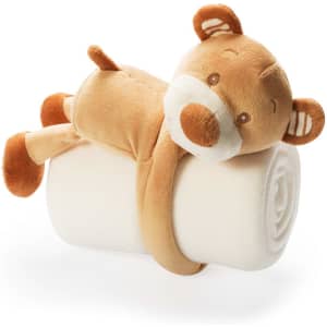 A rolled cream blanket secured with a cute brown bear plush toy, featuring soft ears and a friendly face.