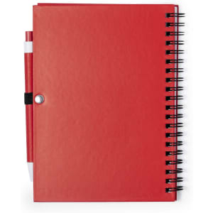 A red Koguel Notebook with a spiral binding and a pen attached in a black holder.