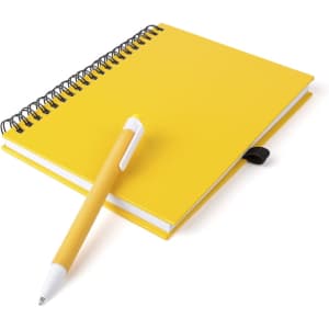 A bright yellow spiral notebook with a white pen placed beside it. The notebook has a smooth, plain cover.